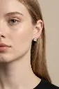 Model wearing Silver Soliatire Earrings.webp