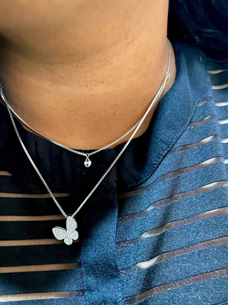 Model butterfly with heart chain-Photoroom.webp