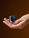 Model Holding Blue Stone Ring-Photoroom.webp